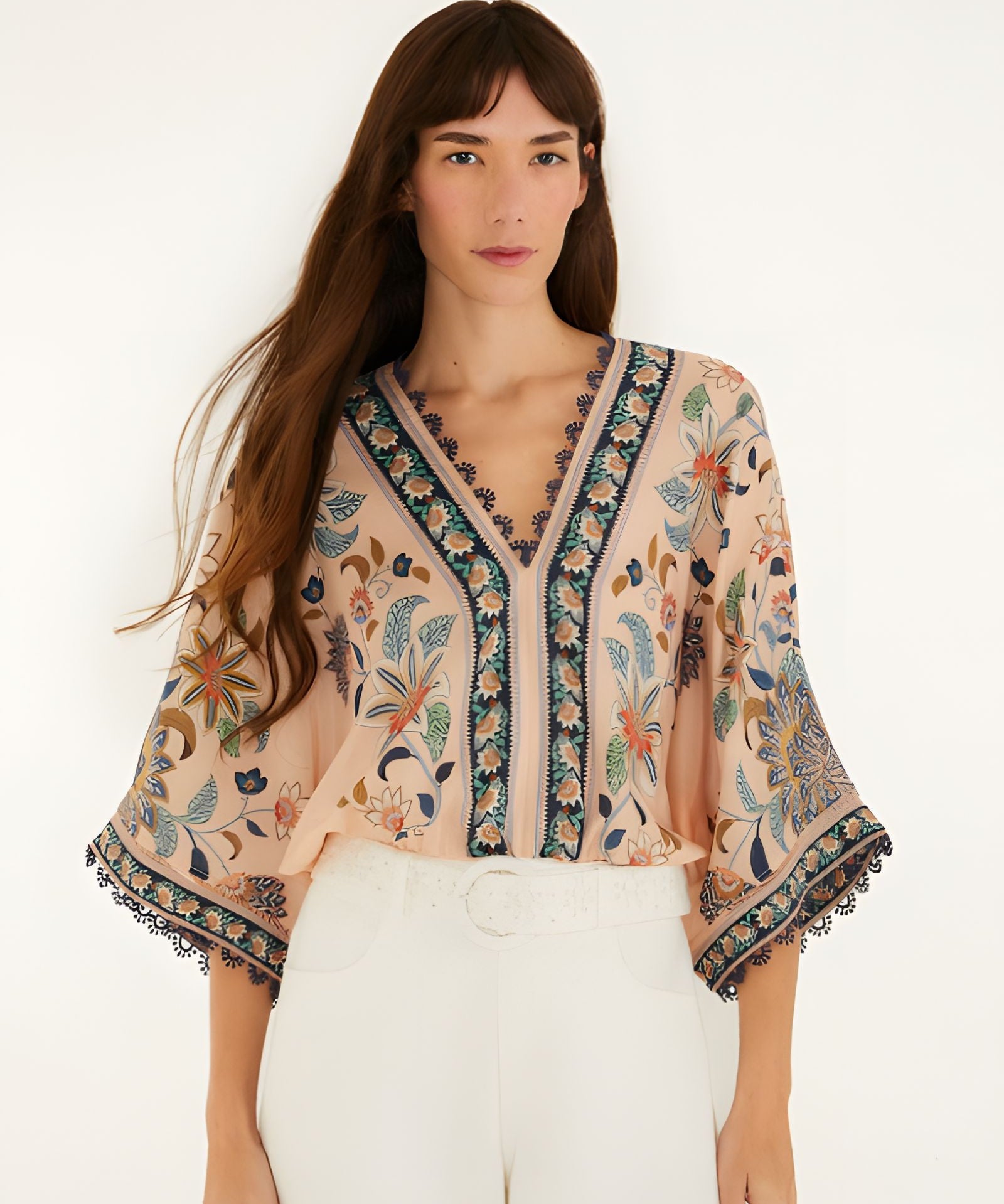 Front view of a model styling the soft pink Farm Rio floral tapestry bodysuit.