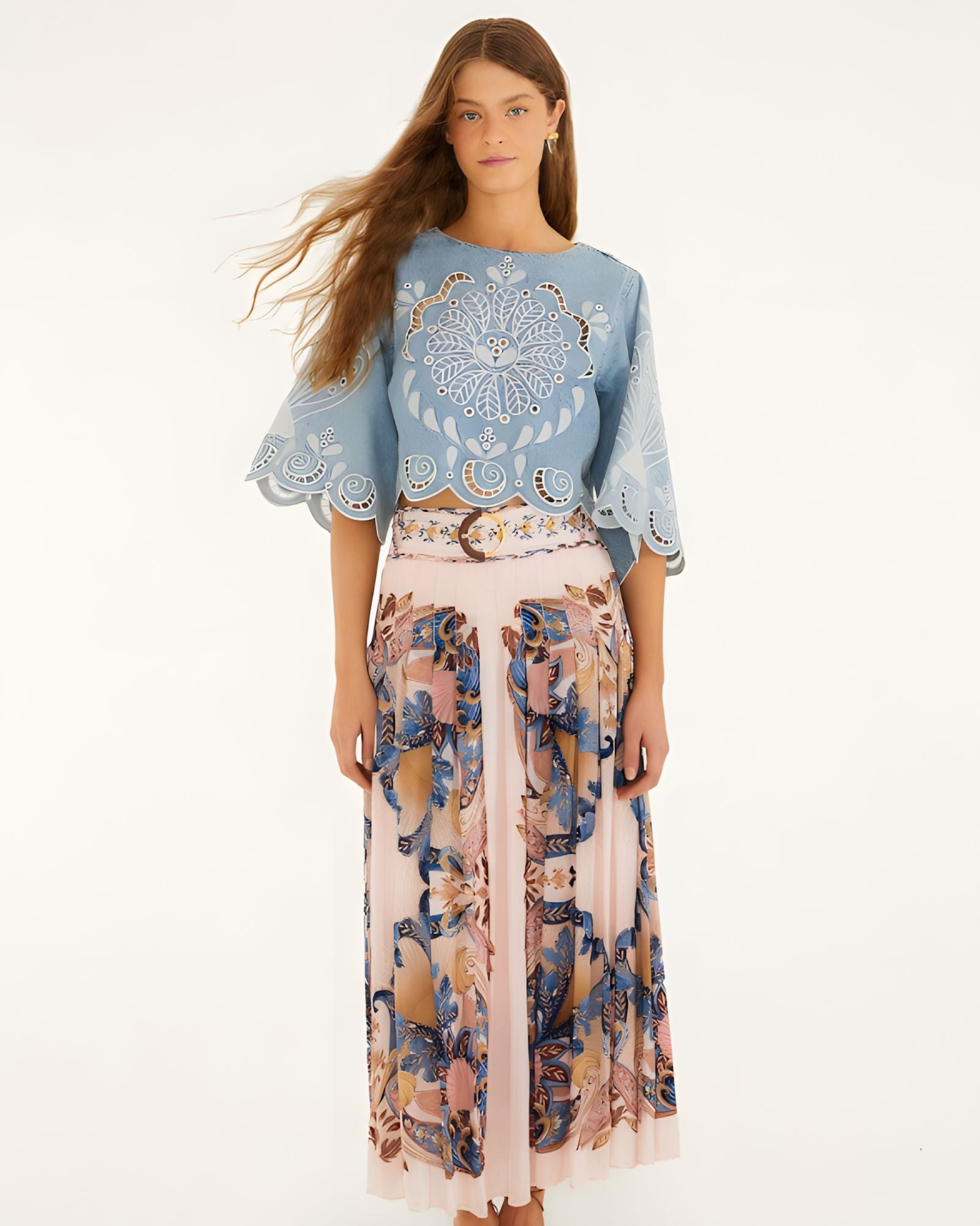 Model wearing Farm Rio soft pink pleated maxi skirt with sea-inspired scarf print, front view