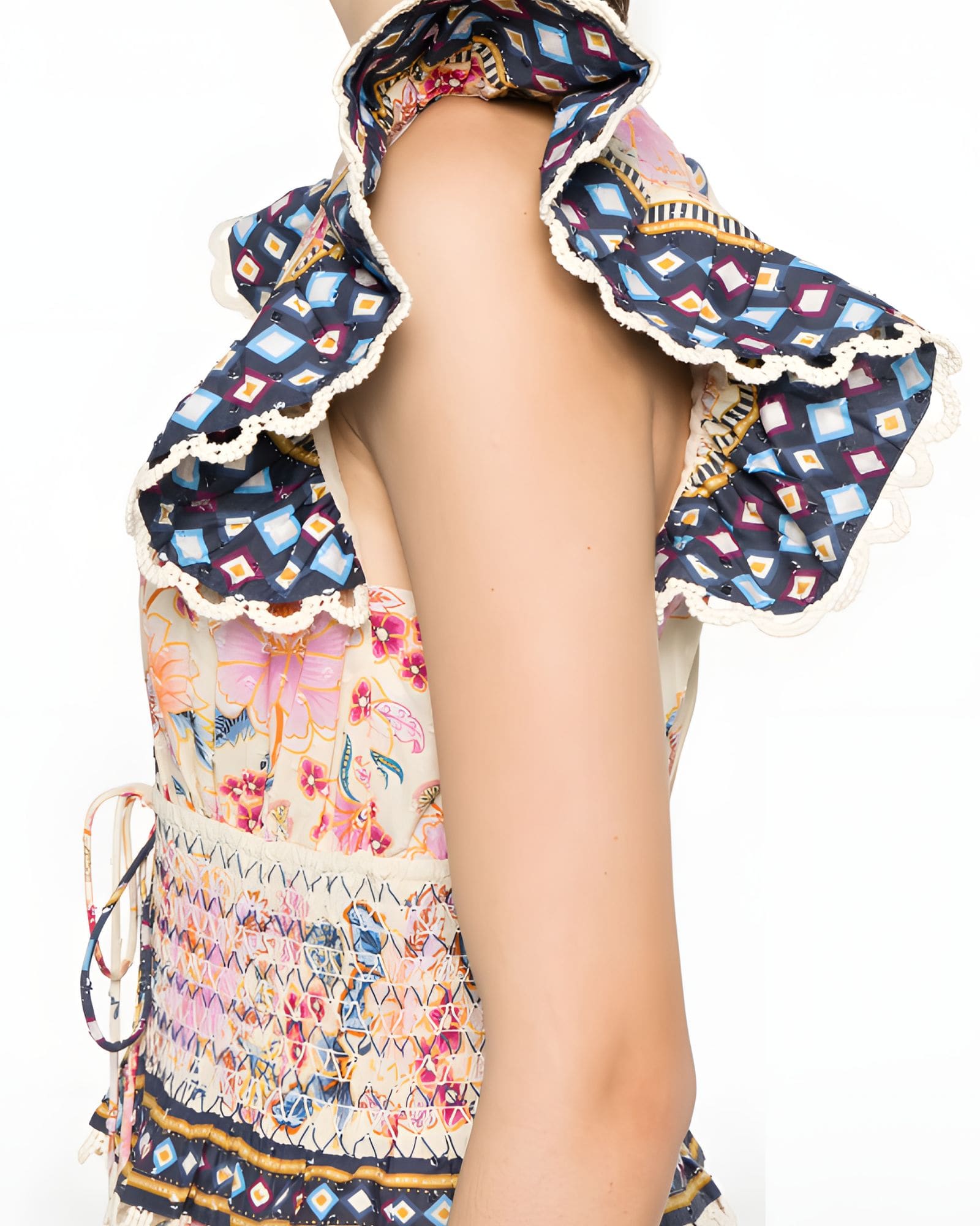 Close-up detail view of the Farm Rio maxi dress, showcasing the textured ruffle shoulder sleeve with its dark geometric contrast border.