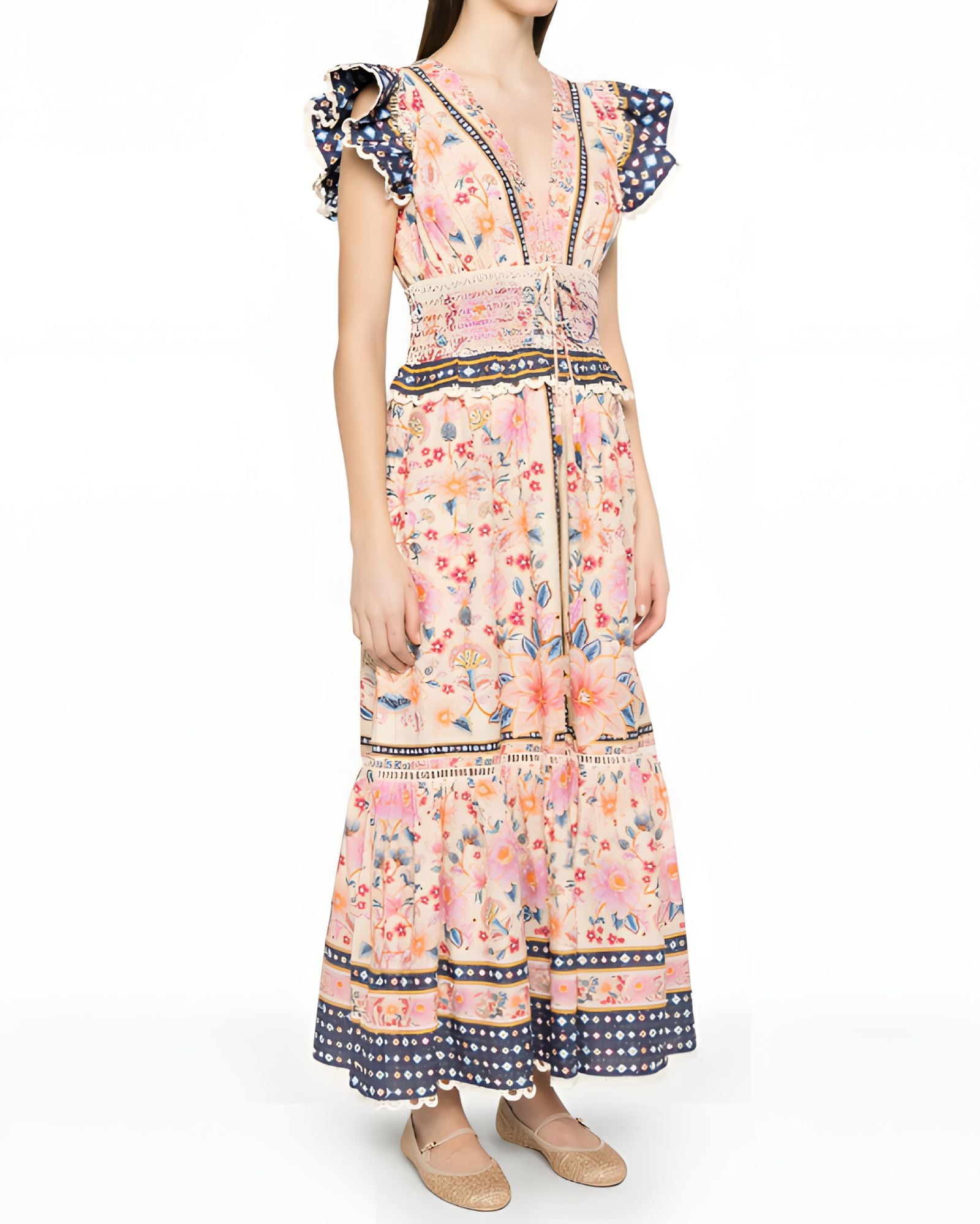 Three-quarter studio view of a model wearing the Farm Rio tapestry printed maxi dress, displaying the elegant drape and tiered skirt layout.