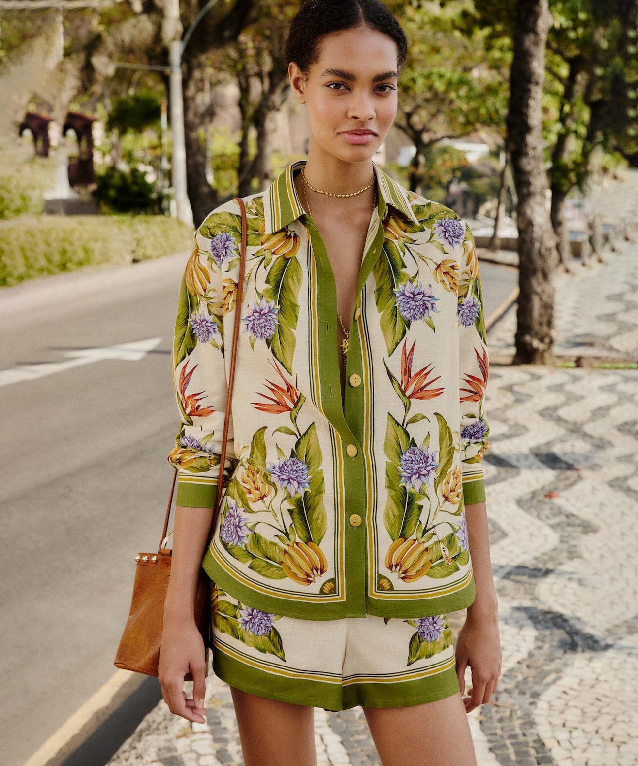 Farm Rio tropical botanical print shirt in green and cream with floral and banana motifs, relaxed fit and button-front design.