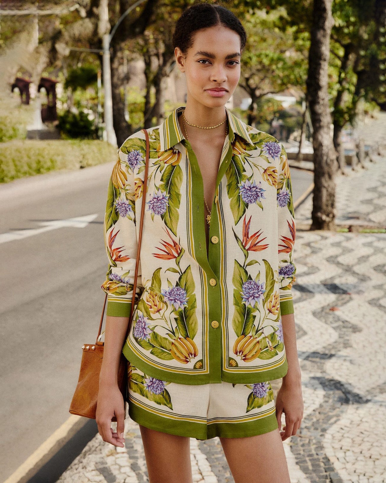Farm Rio tropical botanical print shirt in green and cream with floral and banana motifs, relaxed fit and button-front design.