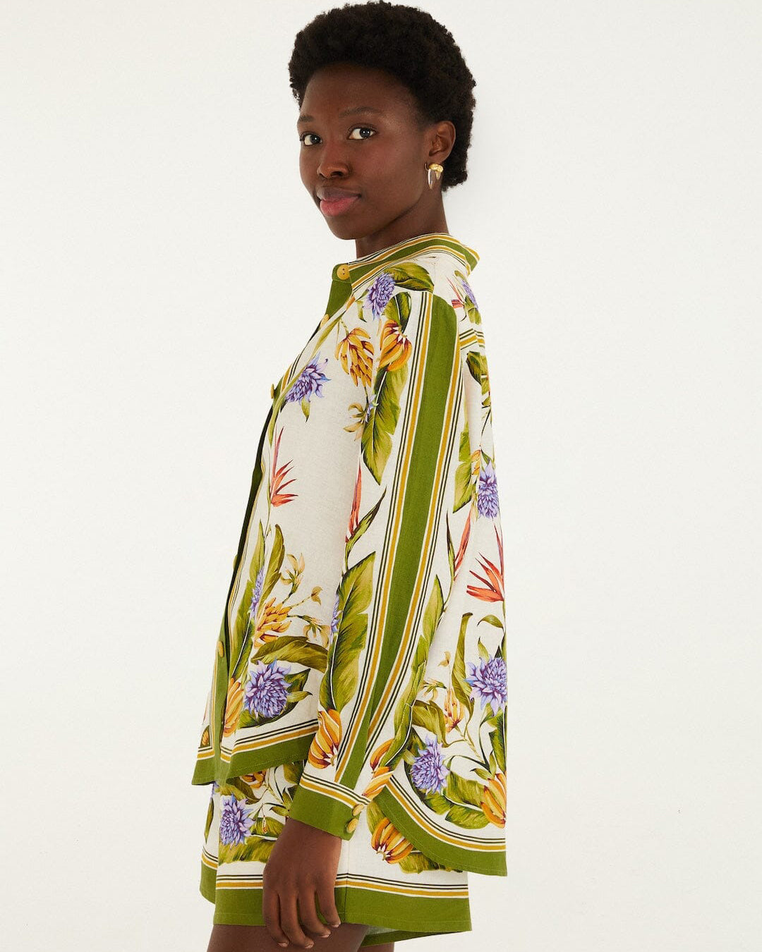 Woman wearing a floral dress with a white background