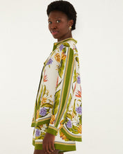 Woman wearing a floral dress with a white background