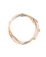 Close-up of Miyuki Beaded Stretch Bracelet Trio in Peach, Aqua, and Turquoise with gold-filled accent.