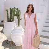 Open-Back Cotton Maxi Dress by INCERTAINES — model wearing the flowing cotton dress with elegant open back, front view