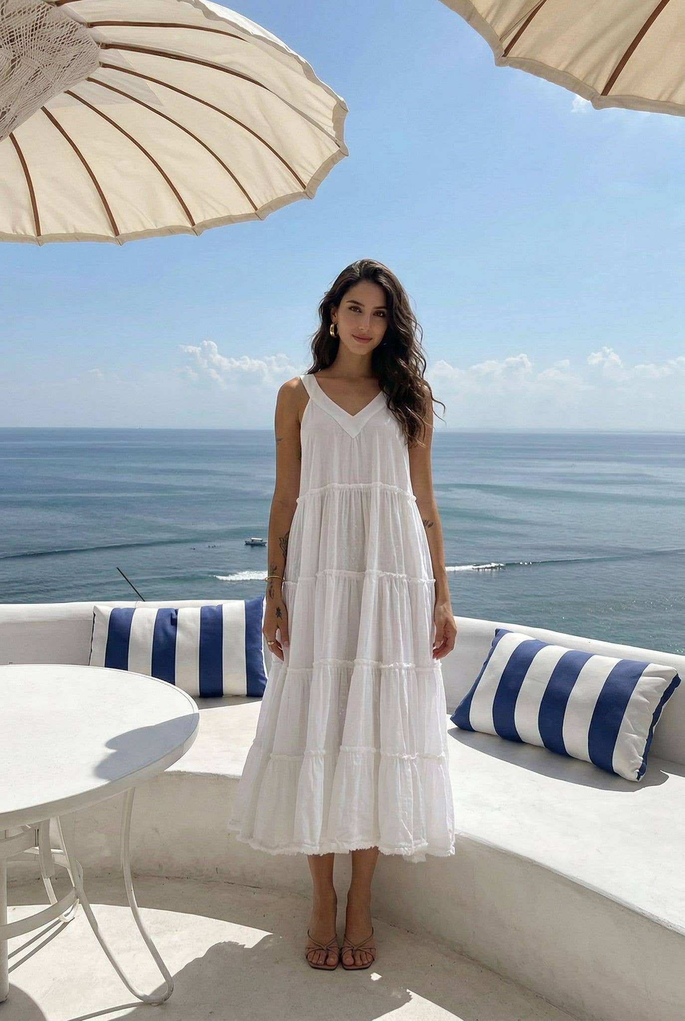 White Cotton Summer Dress by INCERTAINES — model wearing the relaxed one-size white cotton dress, front view