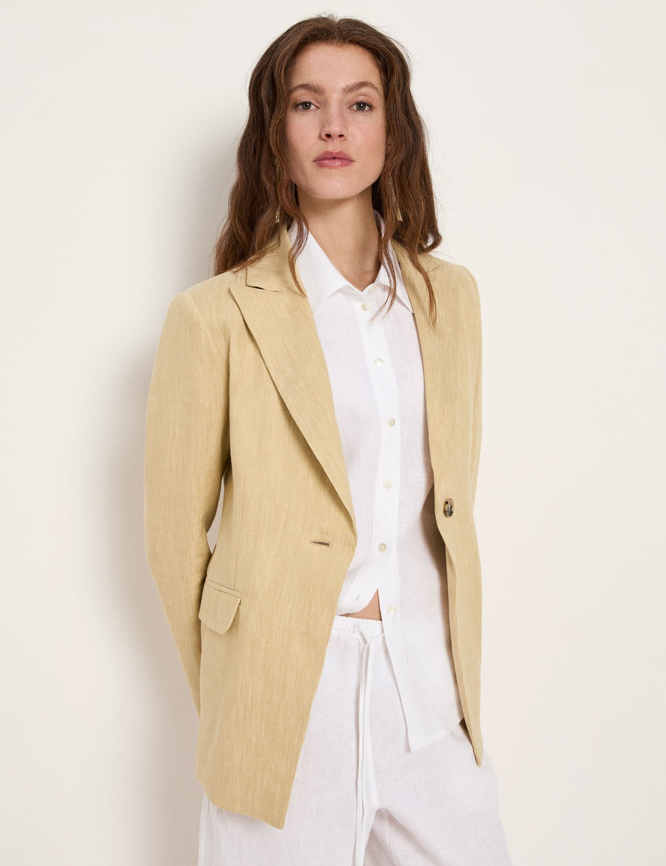 Khaki-creme single-button blazer on model, front view, worn with white shirt.