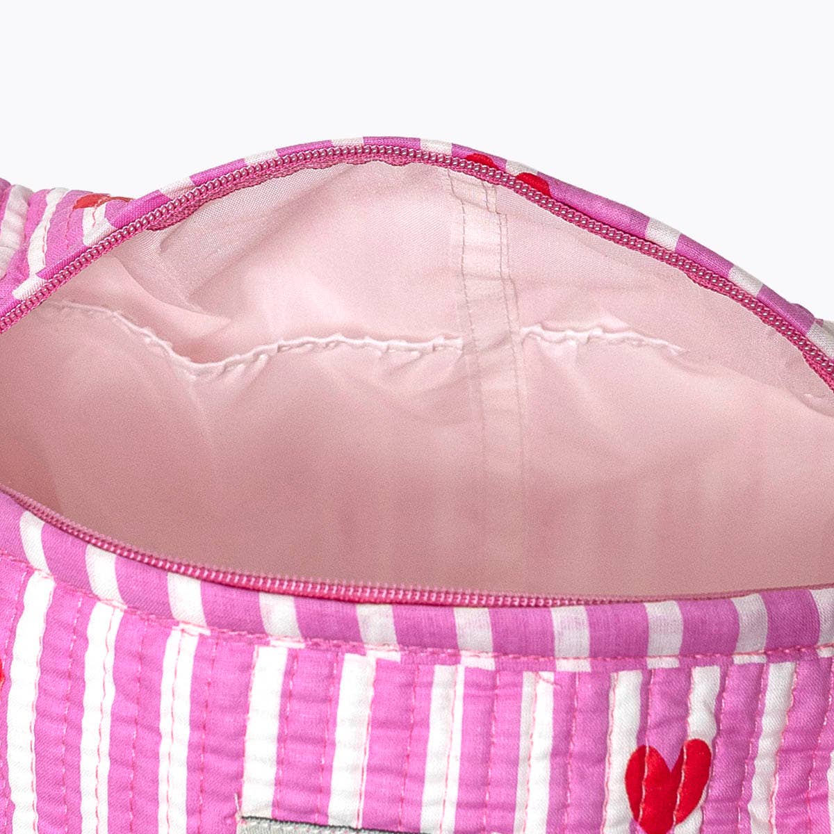 KIKOONI Love Edition pink cosmetic bag with the zip open – top view