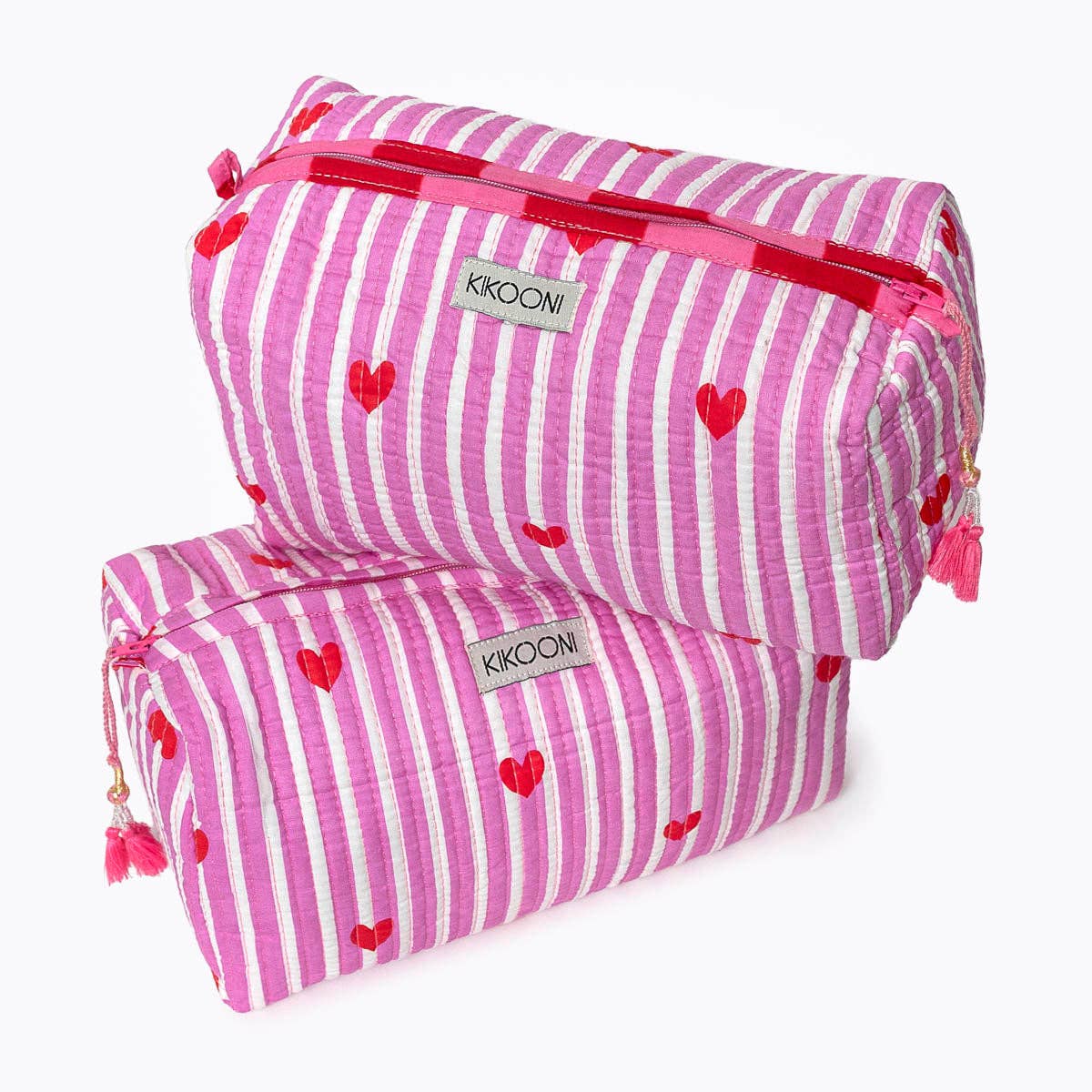 Two KIKOONI Love Edition pink cosmetic bags stacked