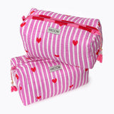 Two KIKOONI Love Edition pink cosmetic bags stacked