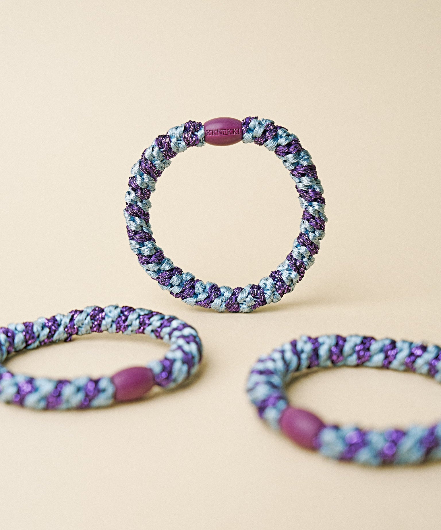 KKNEKKI hair tie Sea Blue & Dark Purple Glitter Stripe – several hair ties together