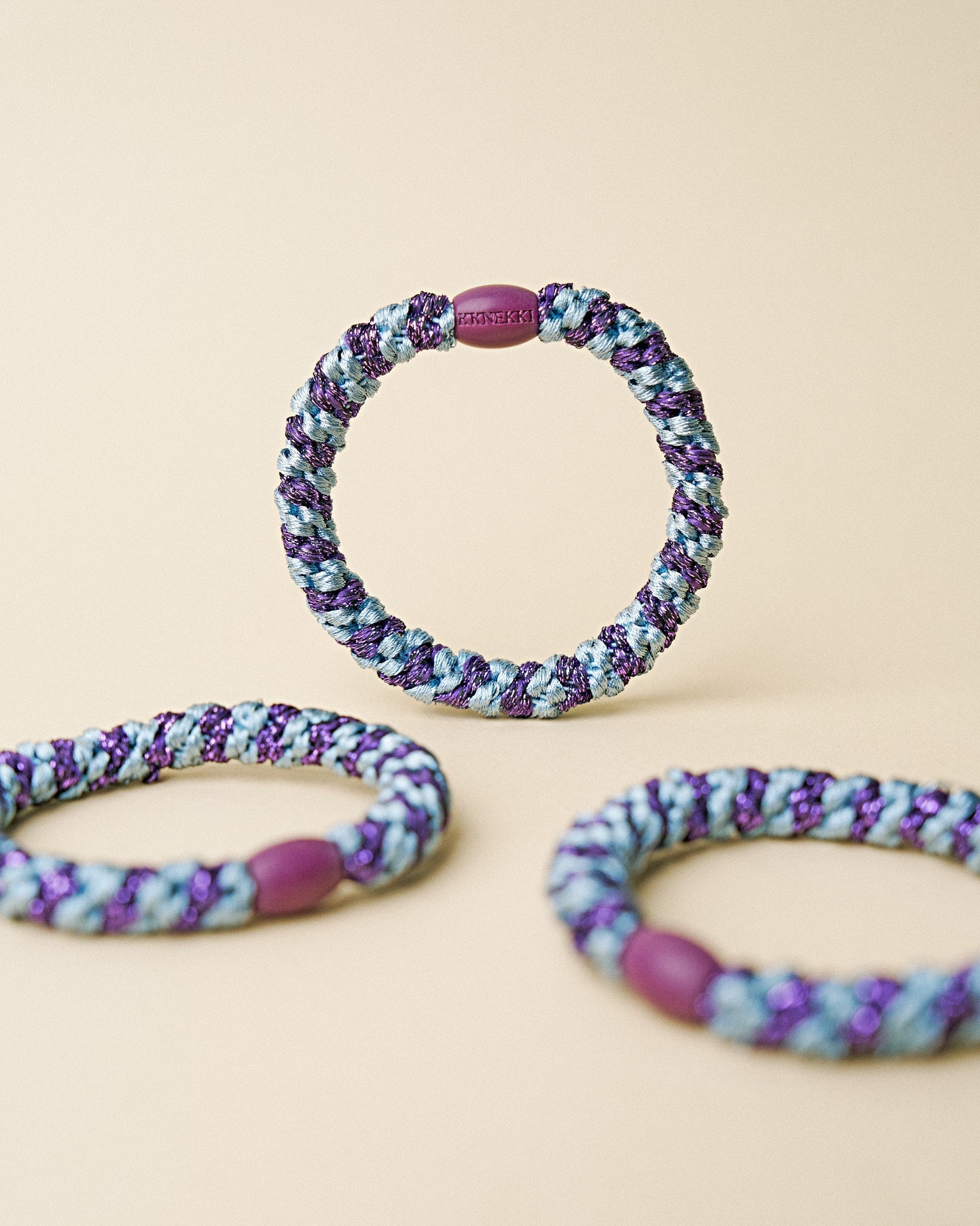 KKNEKKI hair tie Sea Blue & Dark Purple Glitter Stripe – several hair ties together