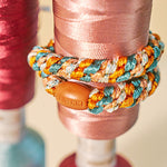 KKNEKKI hair tie Terracotta & Teal Mix – worn on the wrist
