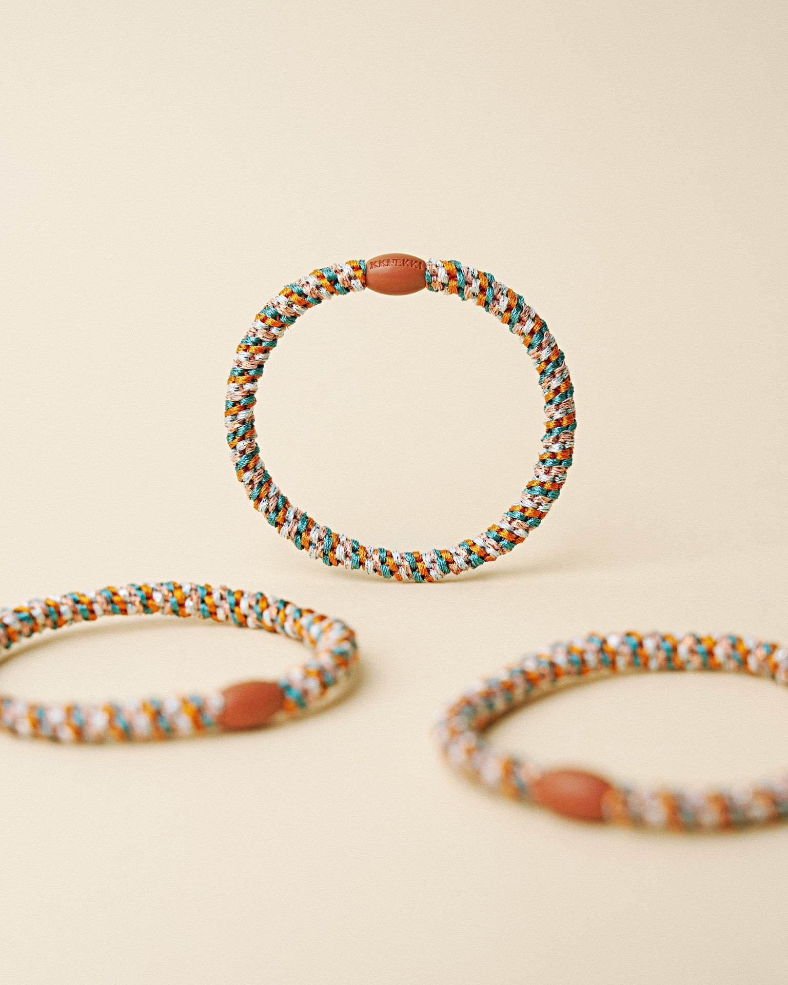 KKNEKKI slim hair tie Terracotta & Teal Mix – several hair ties together