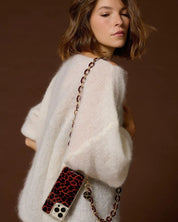 Woman styling the Classy Bordeaux phone chain crossbody with a minimalist look