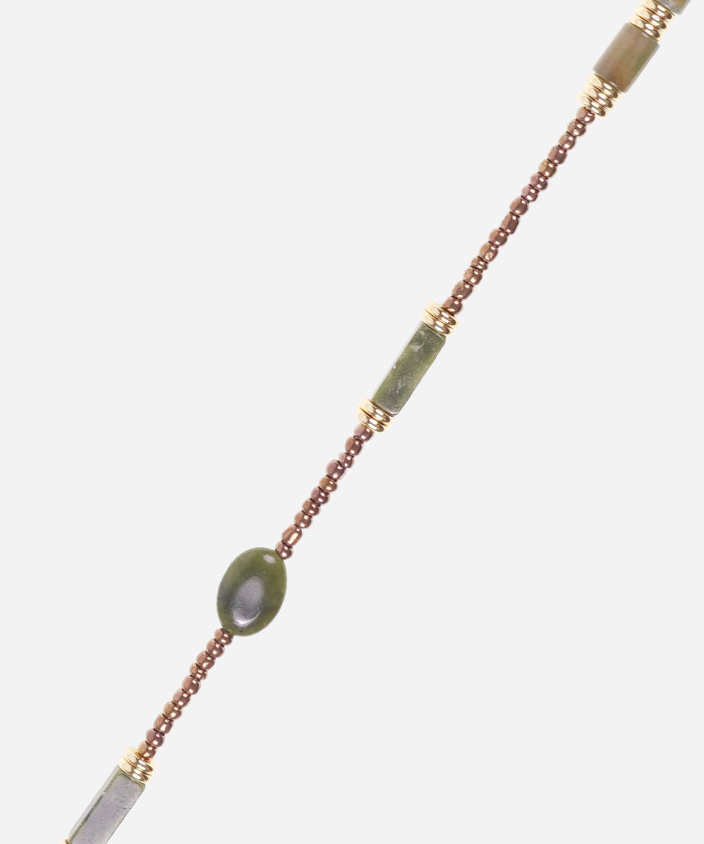 Close-up of the La Coque Française Izzie beaded phone chain in sage green