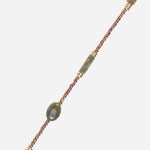 Close-up of the La Coque Française Izzie beaded phone chain in sage green