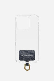 La Coque Française universal phone chain connector in a grey leopard pattern, shown inside a clear case to show how it fits any smartphone.