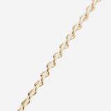 Close-up of the La Coque Française Lou braided phone chain in white and gold