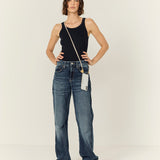 Model wearing the La Coque Française Lou white and gold braided phone chain