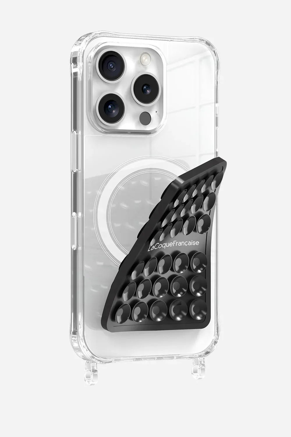 Black La Coque Française Stick-Anywhere Phone Pad applied to a clear phone case for hands-free use.