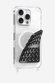 Black La Coque Française Stick-Anywhere Phone Pad applied to a clear phone case for hands-free use.