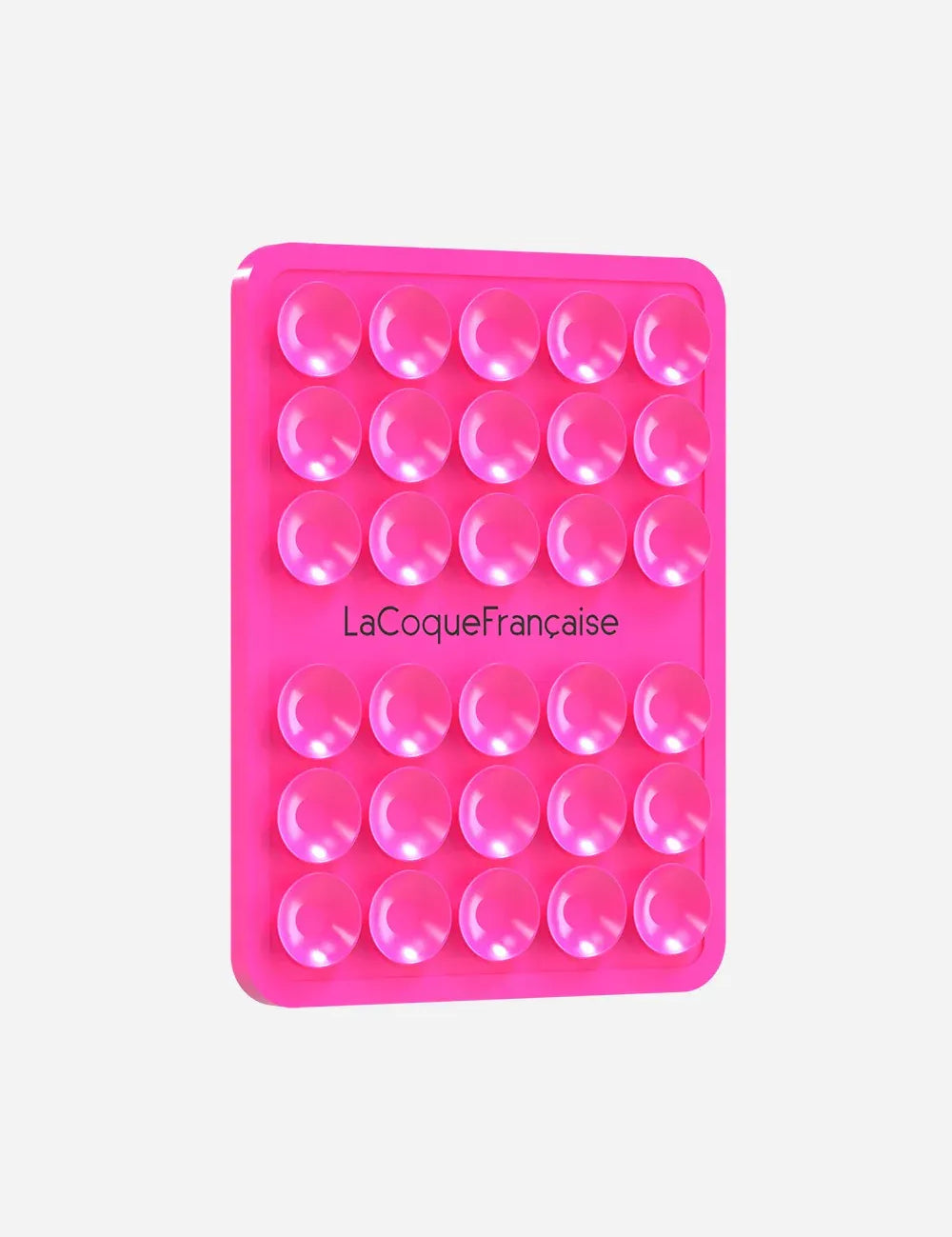 La Coque Française silicone suction phone grip pad in vibrant neon pink, featuring multiple small suction cups for hands-free mounting