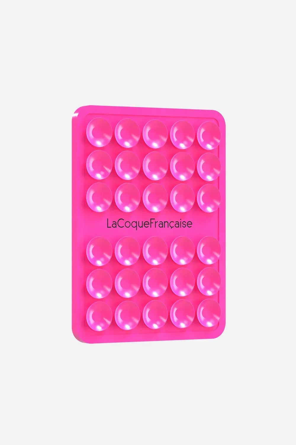 La Coque Française silicone suction phone grip pad in vibrant neon pink, featuring multiple small suction cups for hands-free mounting