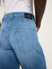 Close-up of the back pocket and mid-rise waistband on Lanius organic blue denim jeans, GOTS certified