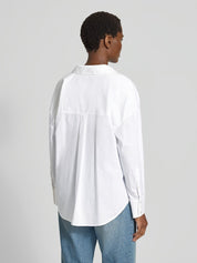 Lanius white shirt showing the dropped shoulders and the relaxed oversized silhouette