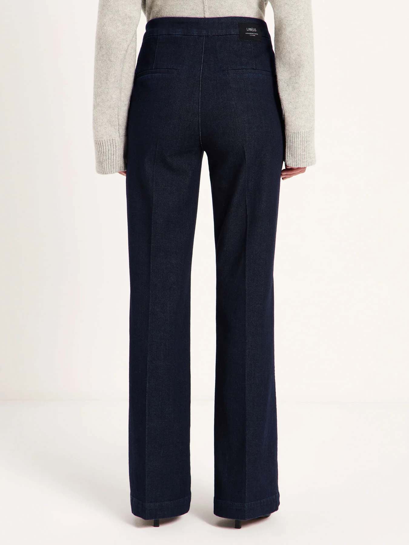 LANIUS Willow flared jeans in rinsed raw denim, back view