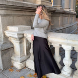 MICUIR Danseur de Roche black Mary Jane flat worn with a long satin skirt