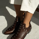 MICUIR Punky chocolate studded ankle boots worn with cream trousers