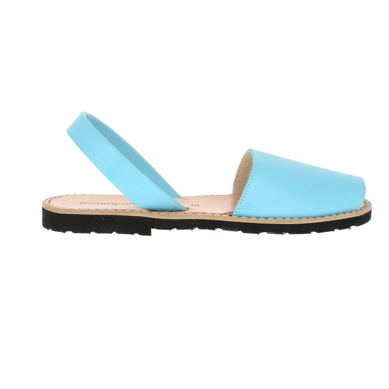 Minorquines aquamarine blue leather avarca sandal worn on the foot, side view