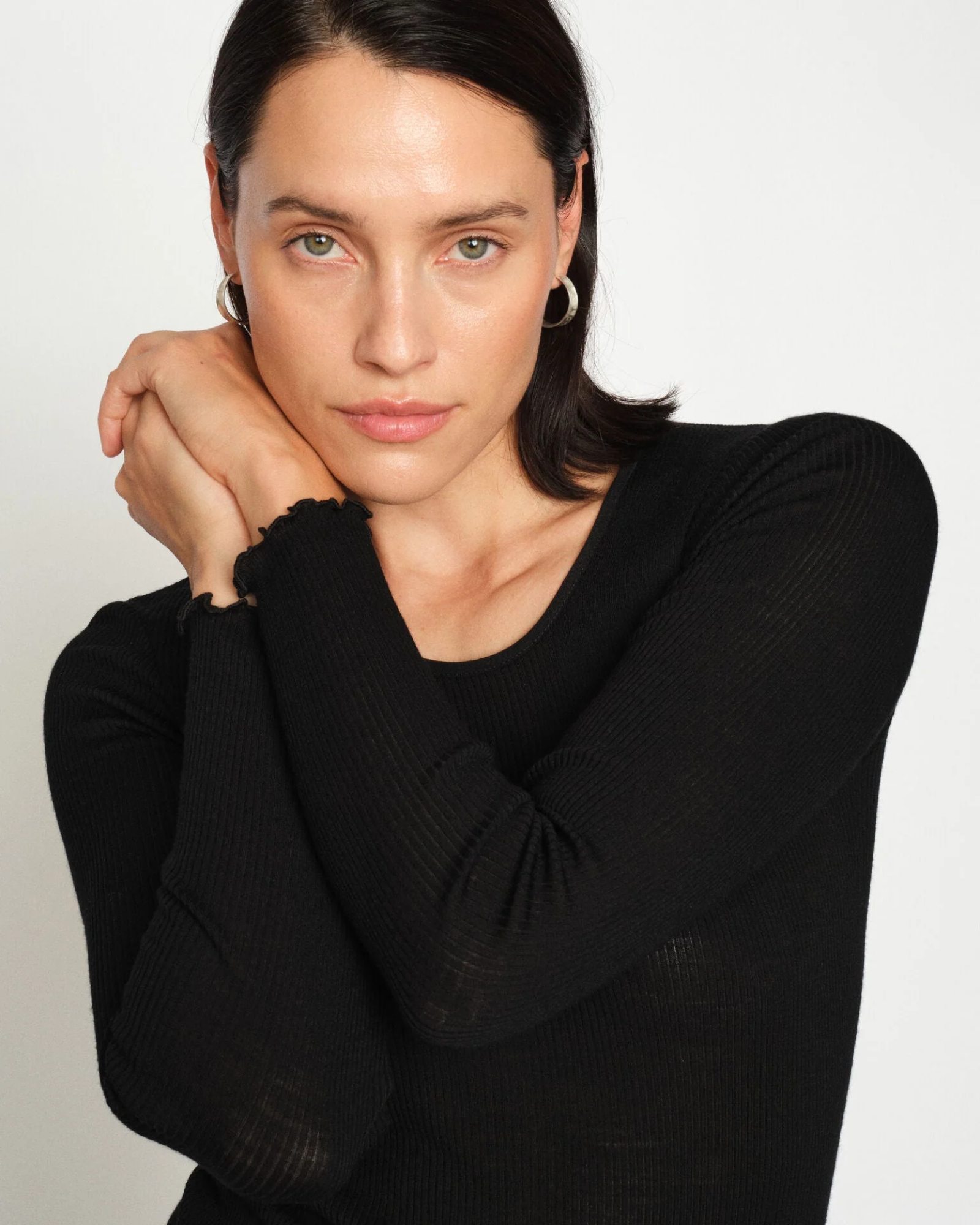 Close-up of MMElaine Seamless Silk Tee in Black, sleeve detail