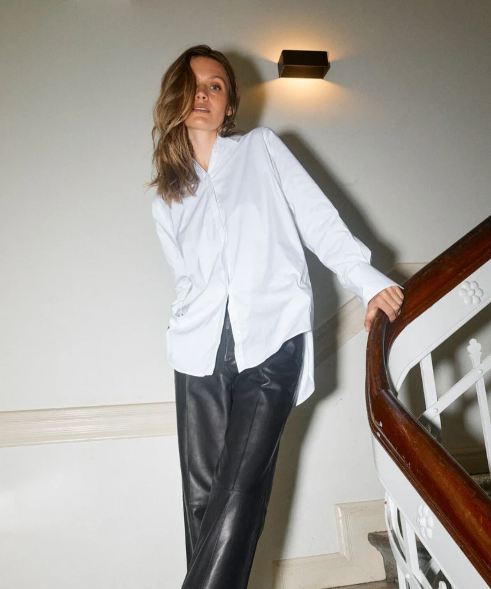 Model wearing MMEnola Shirt in White, front pose