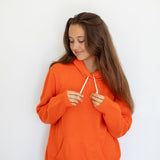 Nuage Cashmere Hoodie – Aperol – worn by a model