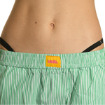 Close-up of the waistband of the Sandia green striped cotton wide-leg pants