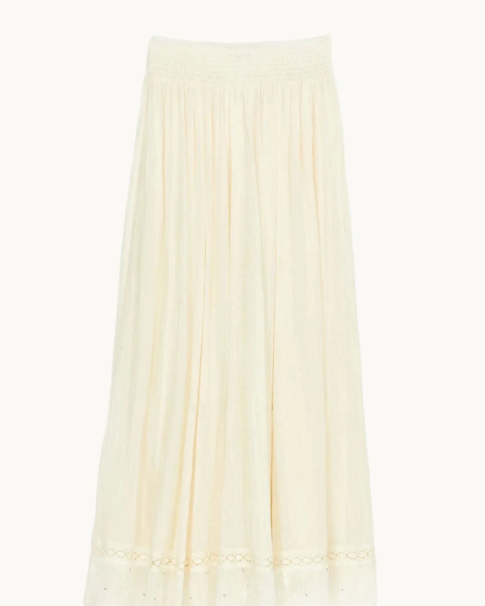 Mabe Apparel cream cotton maxi skirt with a smocked waistband and lace-trimmed hem.