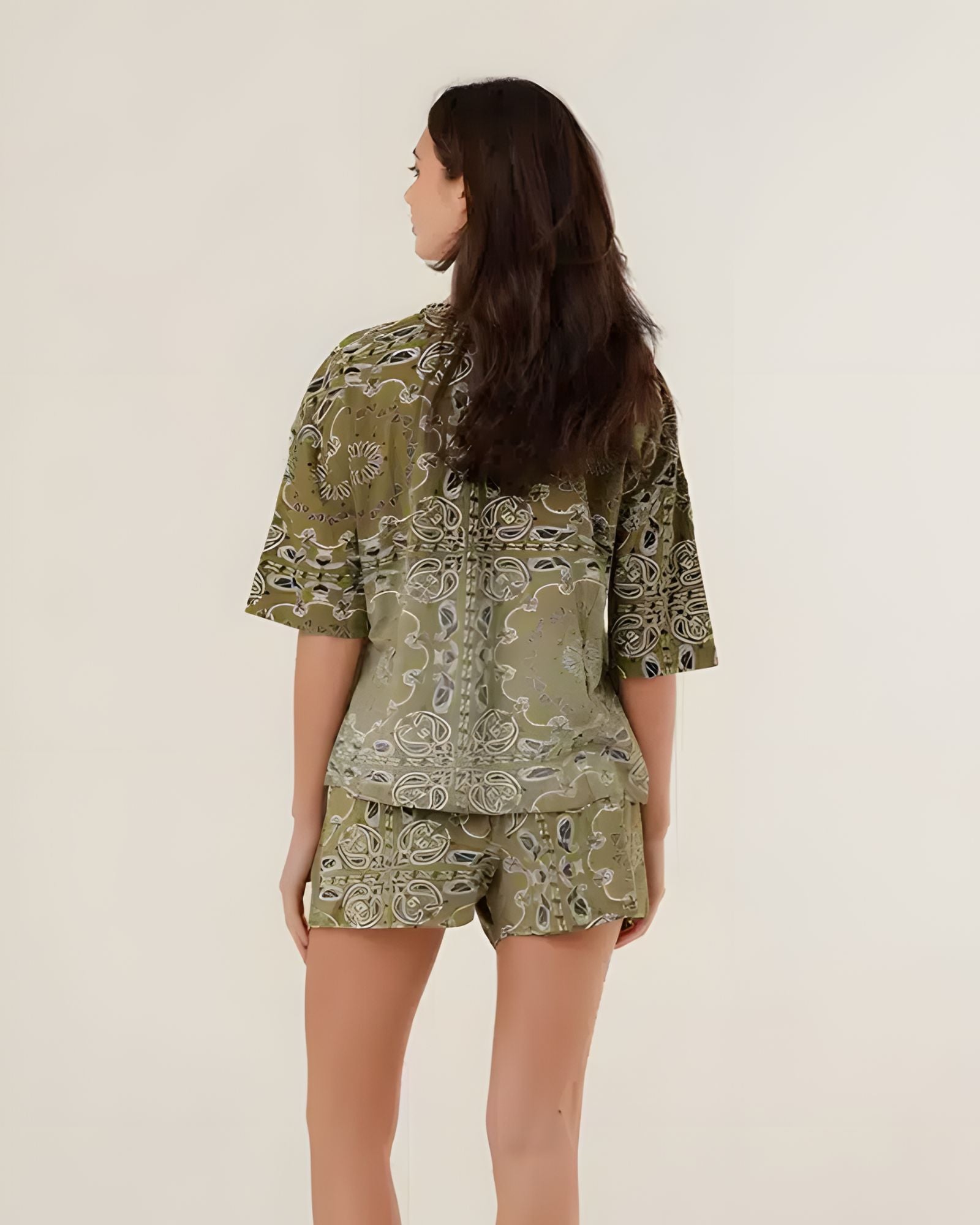 Rear view of the 100% cotton Henry bandana print t-shirt in khaki on a model, highlighting its comfortable oversized drape and vintage pattern.