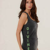 Side view of the carbone Top Mia tank top on a model, explicitly showcasing the bold vertical green "DIVINE" graphic print along the side.