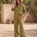 Van Palma Lune wide-leg linen trousers in olive green, worn by a model