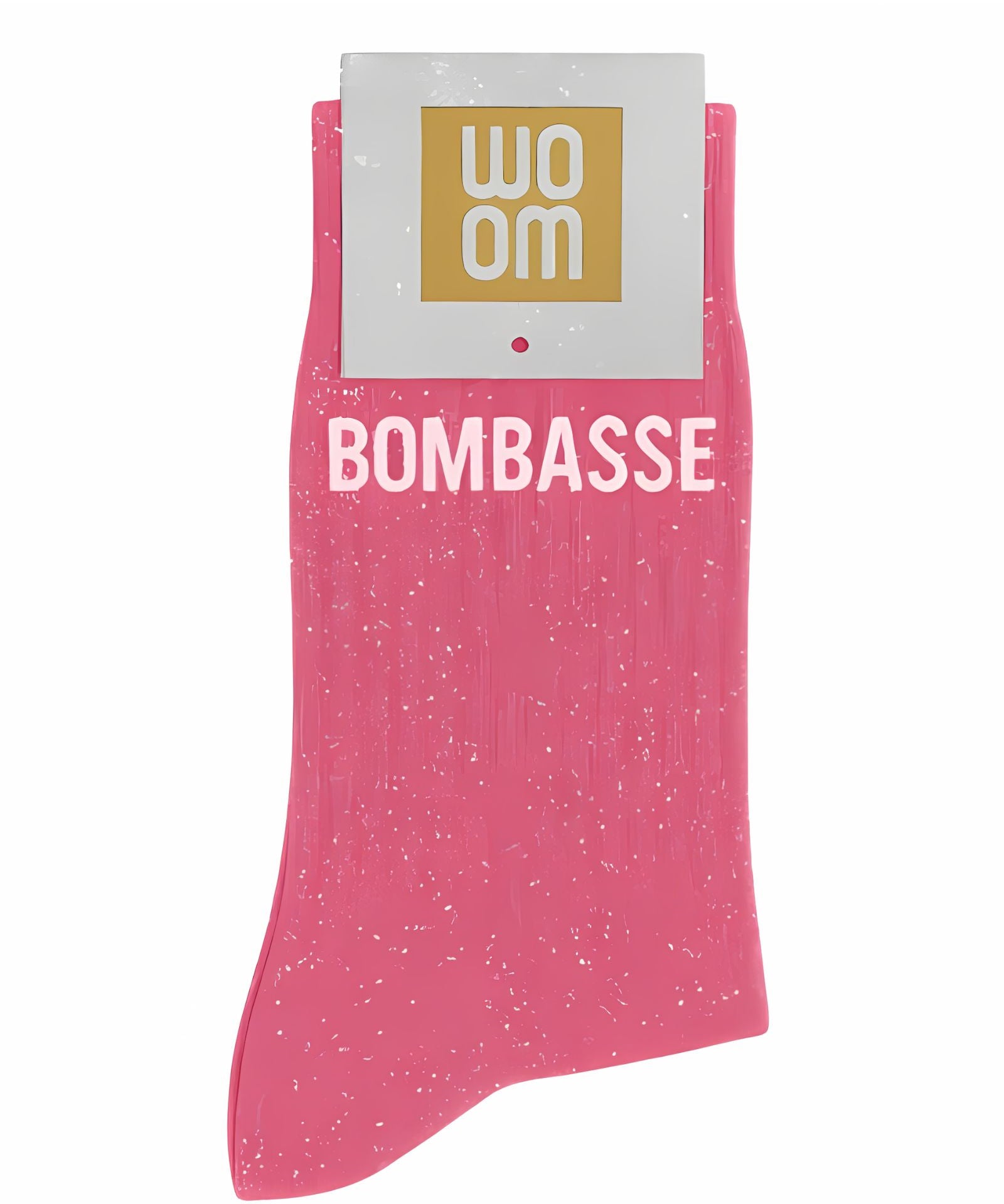 Bubble gum pink glitter message socks with a white jacquard BOMBASSE inscription at the ankle, presented in their original Woom paper packaging.