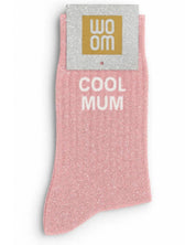 Lovely pink glitter message socks with a white jacquard COOL MUM inscription at the ankle, presented in their original Woom paper packaging.