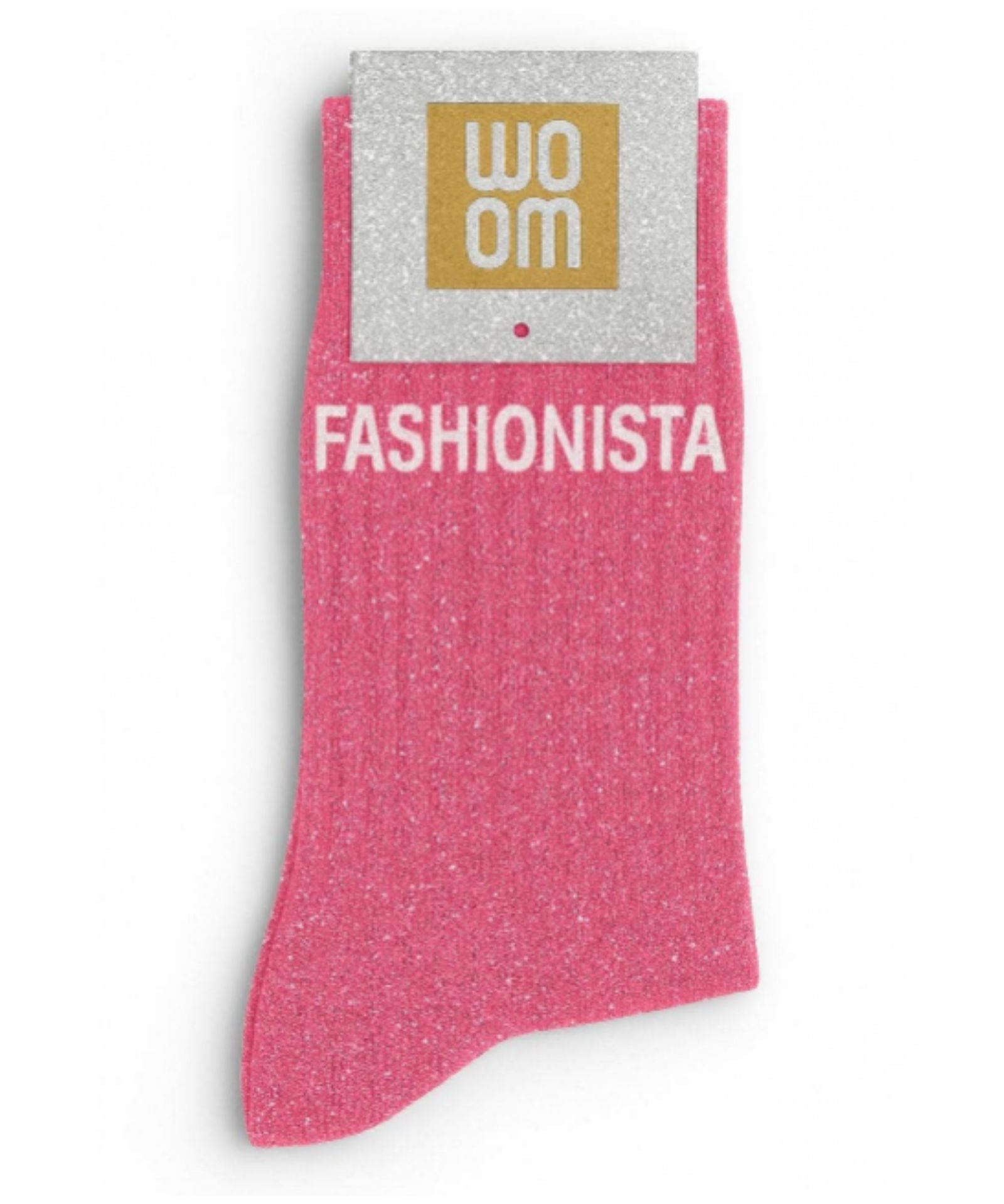 Vibrant pink glitter message socks with a white jacquard FASHIONISTA inscription at the ankle, presented in their original Woom paper packaging.