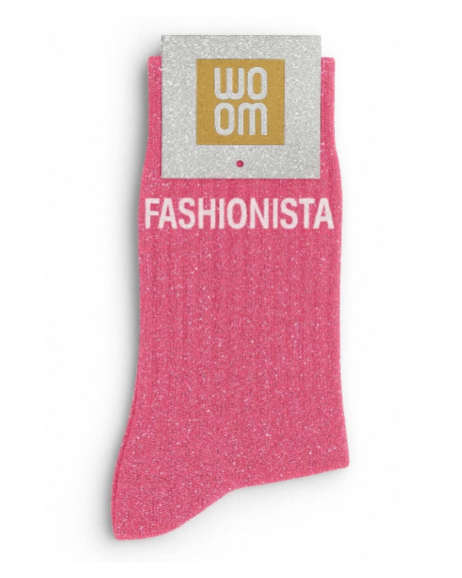 Vibrant pink glitter message socks with a white jacquard FASHIONISTA inscription at the ankle, presented in their original Woom paper packaging.