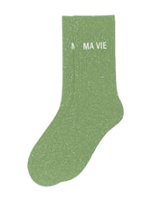 Side profile view of the almond green glitter sock showing the comfortable elasticated ankle and the clean white MA VIE wording detail.