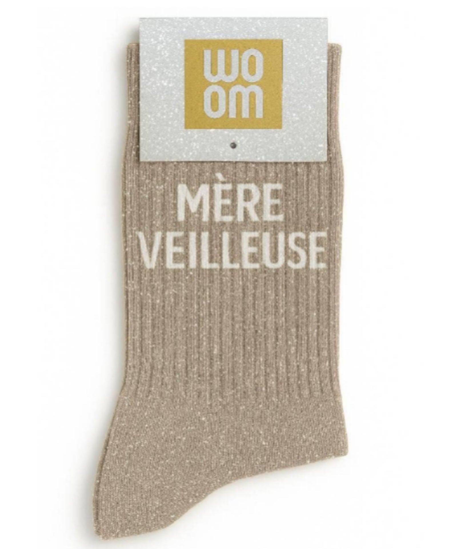 Elegant beige glitter message socks with a white jacquard MÈRE VEILLEUSE inscription at the ankle, presented in their original Woom paper packaging.