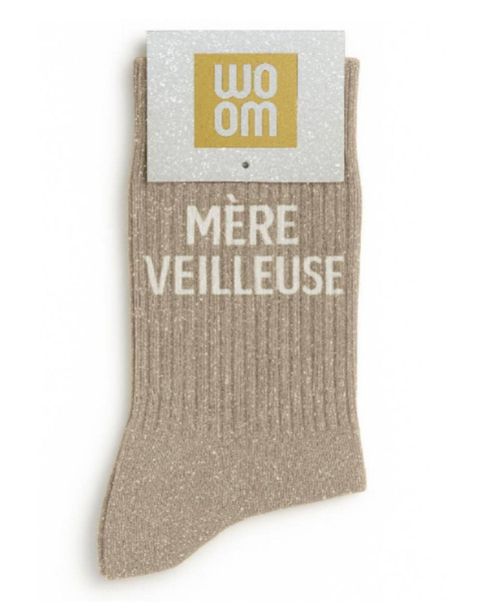 Elegant beige glitter message socks with a white jacquard MÈRE VEILLEUSE inscription at the ankle, presented in their original Woom paper packaging.